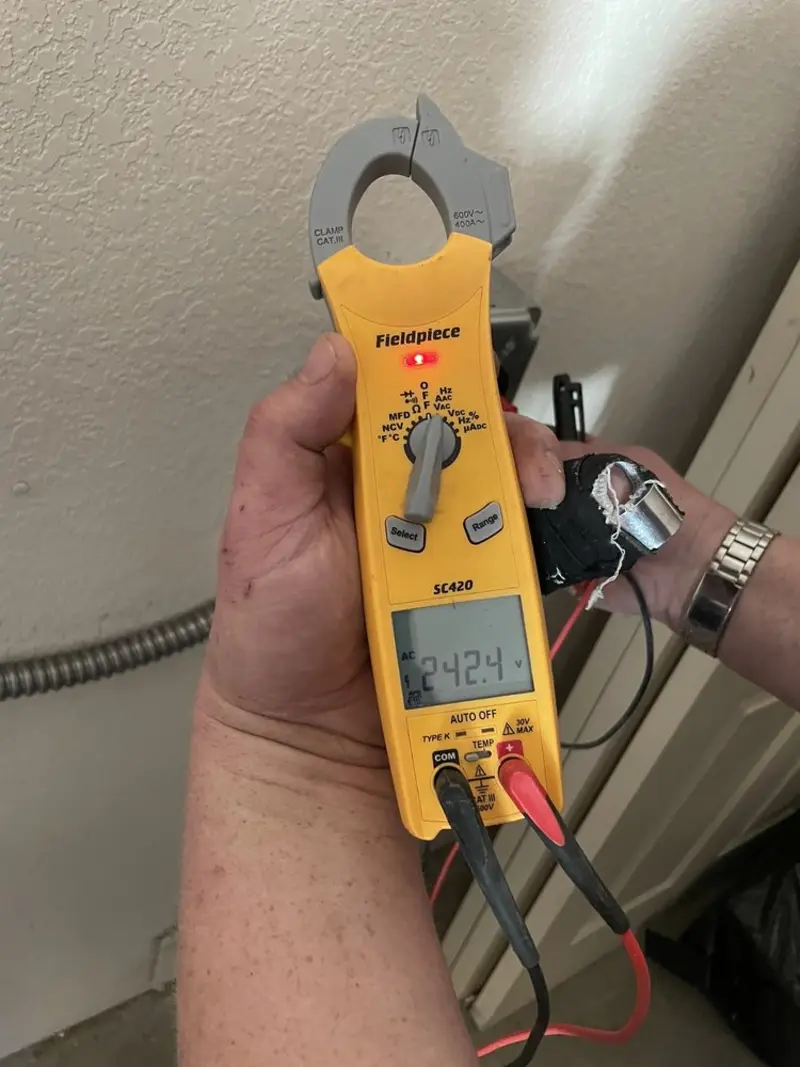 Voltage testing with clamp meter during Generator Installation in Leland